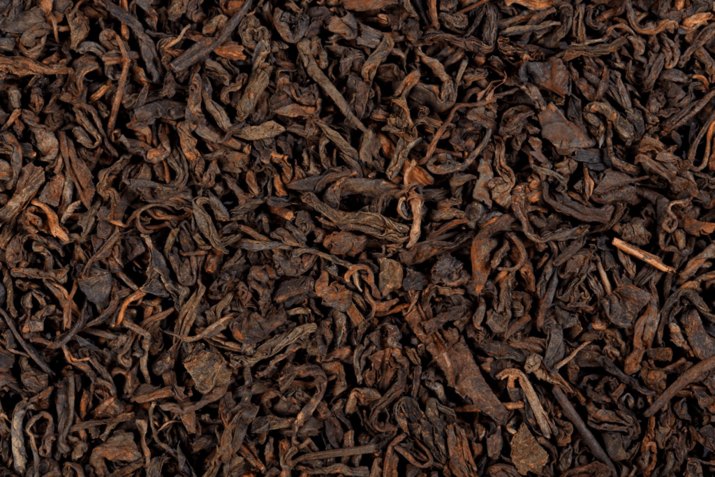 close up texture of sheng puerh loose tea leaves