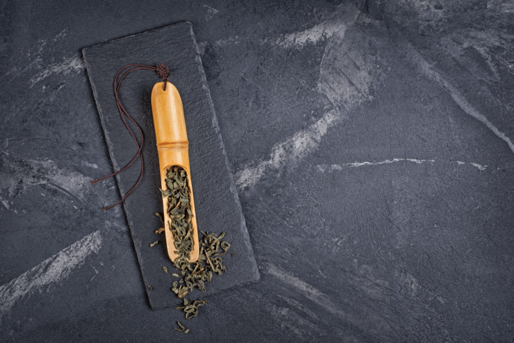 green tea leaves measured for brewing