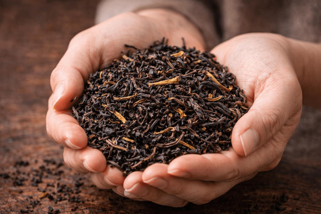 person smelling loose leaf tea to evaluate aroma quality