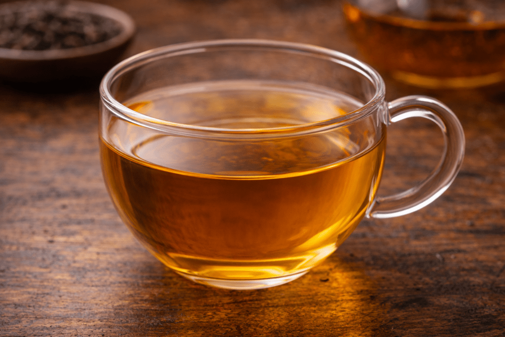 clear tea infusion in glass cup showing bright tea liquor