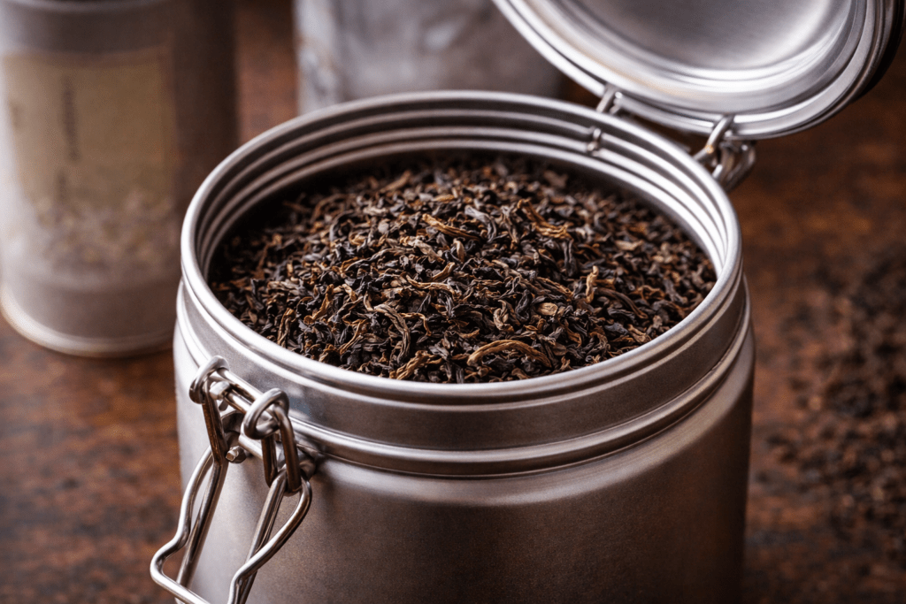 airtight metal tea container filled with loose leaf tea for proper storage